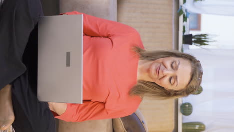 Vertical-video-of-Woman-making-video-call-on-laptop.
